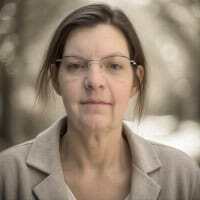 Headshot of Sheri Byrne-Haber wearing glasses and a beige blazer.